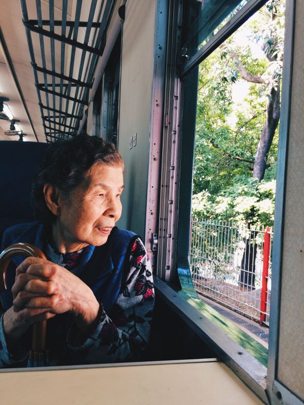 Grandma sitting in the Hong Kong Railway Museum thumbnail