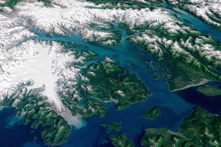 Meltwater from the Brady Glacier (shown in the foreground) is seen in Glacier Bay National Park and Preserve. The water in the foreground in the southwest (bottom left) corner of the image is the Gulf of Alaska. 

