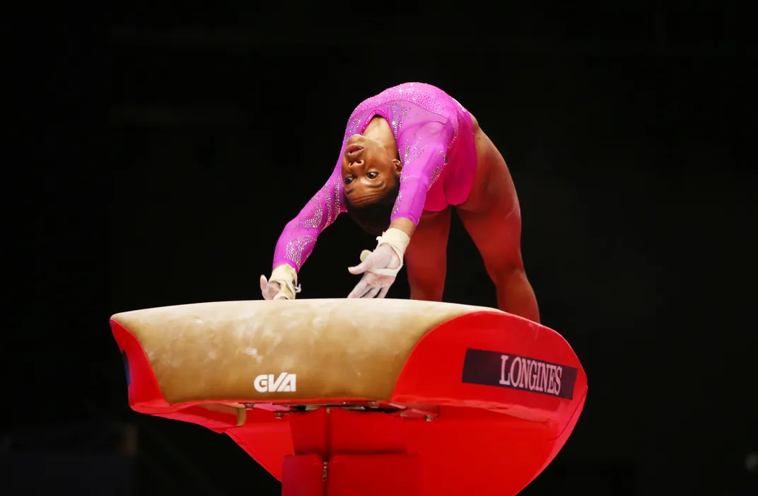 Gabby Douglas, the 2012 women's all-around champion, competes on the vault during the  2015 World Artistic Gymnastics Championships in Glasgow, Scotland.