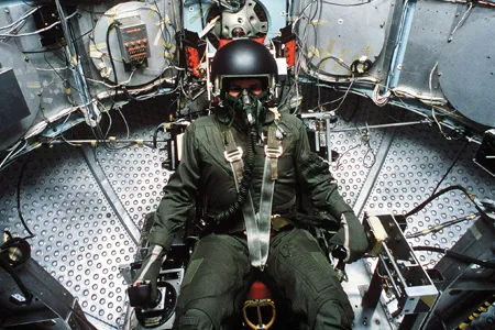At Wright-Patterson Air Force Base in Ohio, a study subject is wired for a spin in the Dynamic Environment Simulator, a centrifuge that excels in inducing spatial disorientation.
