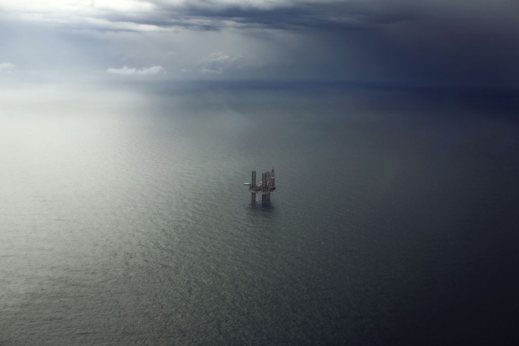 An oil platform sits in the ocean