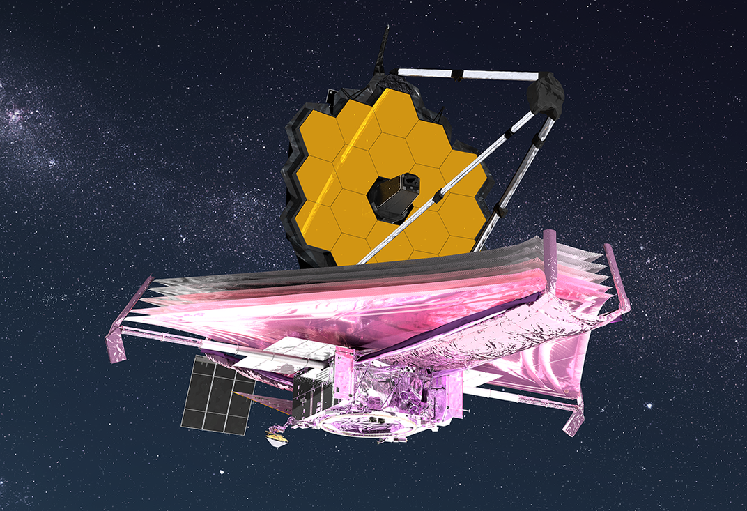 An artist conception of the telescope in space. The background is dark with twinkly stars. The telescope's sunshield in the foreground reflect pink and purple light, and the gold hexagonal pieces of the primary mirror are above it.