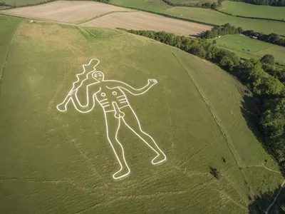 Researchers have long debated the Cerne Abbas Giant's age, with some dating it to the prehistoric period and others to the medieval era.