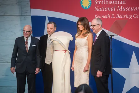 NMAH director John Gray, designer Hervé Pierre, First Lady Melania Trump and Smithsonian secretary David Skorton pose with the silk crepe gown.