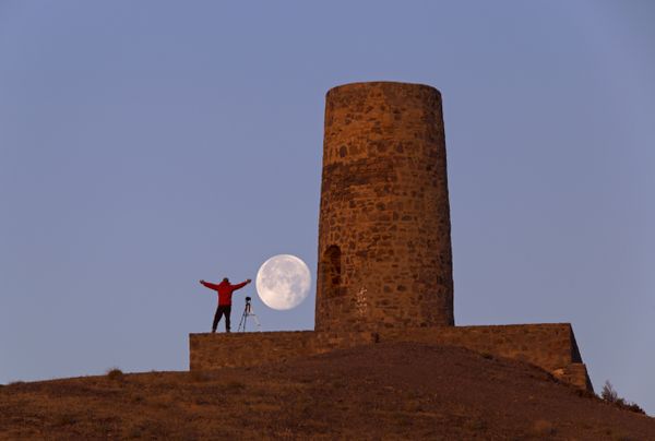 Moonset and ancient tower thumbnail