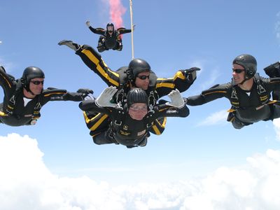 Back in 2004, former U.S. President George H.W. Bush (bottom jumper) celebrated his 80th birthday with a tandem parachute jump over Texas A&M University with the U.S. Army Golden Knights parachute team.