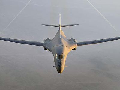 A B-1B Lancer flies a combat patrol over Afghanistan in support of Operation Enduring Freedom. The B-1B has the capability to carry guided and unguided weapons and deliver massive quantities of precision and non-precision weapons against specific targets. (U.S. Air Force photo/Staff Sgt. Aaron Allmon)