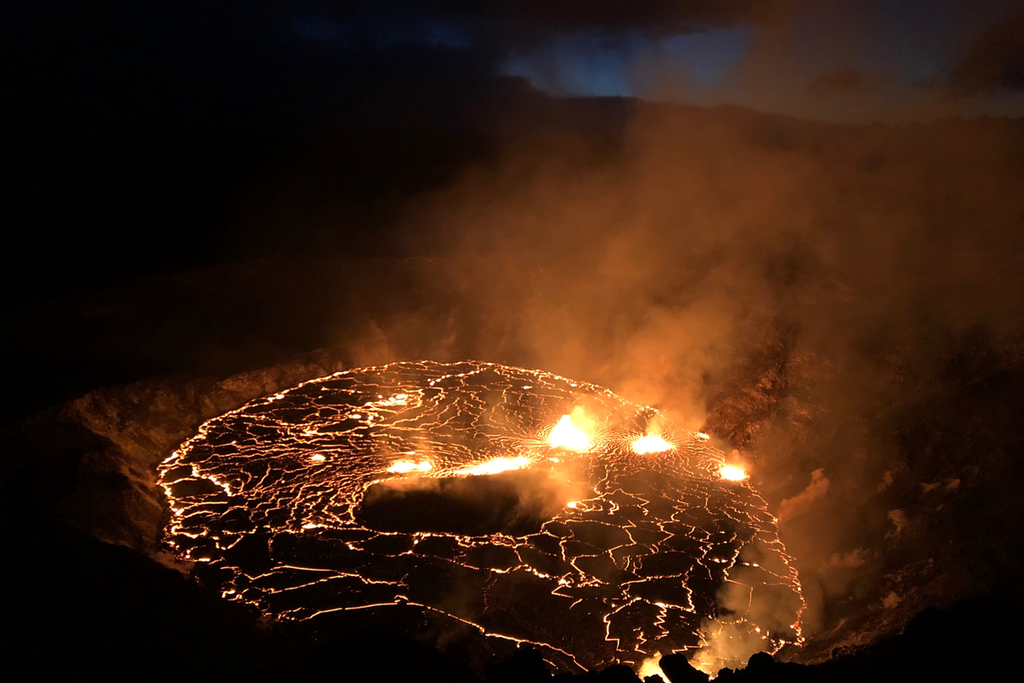 An image of the glowing red fissures inside of the Halema'uma'u Crater located on the Kīlauea volcano's summit