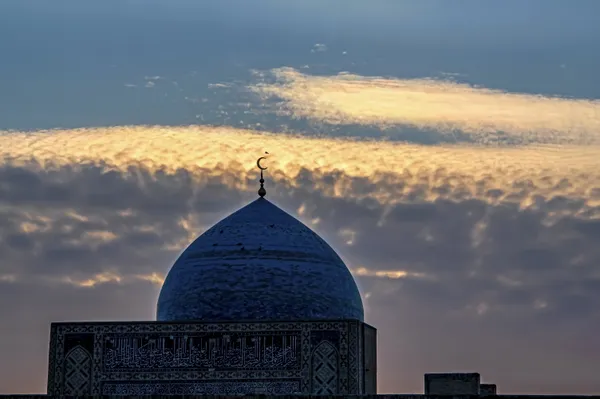 Mosque under colored clouds thumbnail