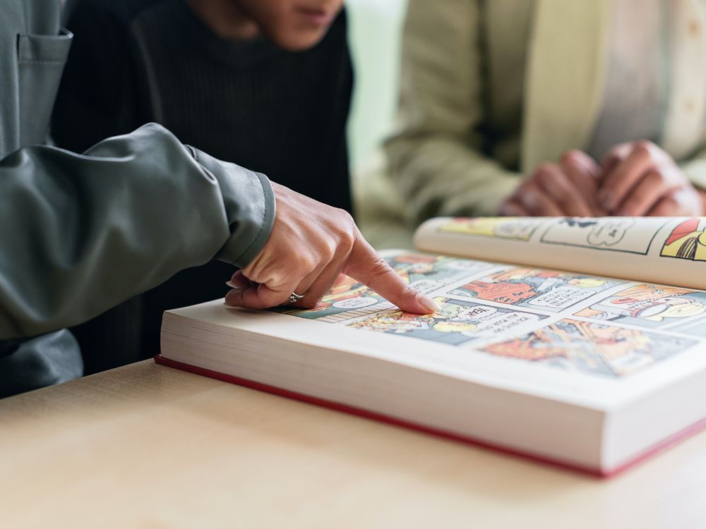 Person looking at comic book