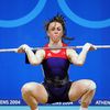 Tara Nott Cunningham attempts a snatch during the 2004 Olympic Games in Athens.