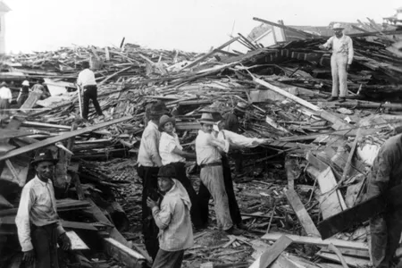 A relief party works to find bodies after the hurricane's destruction.