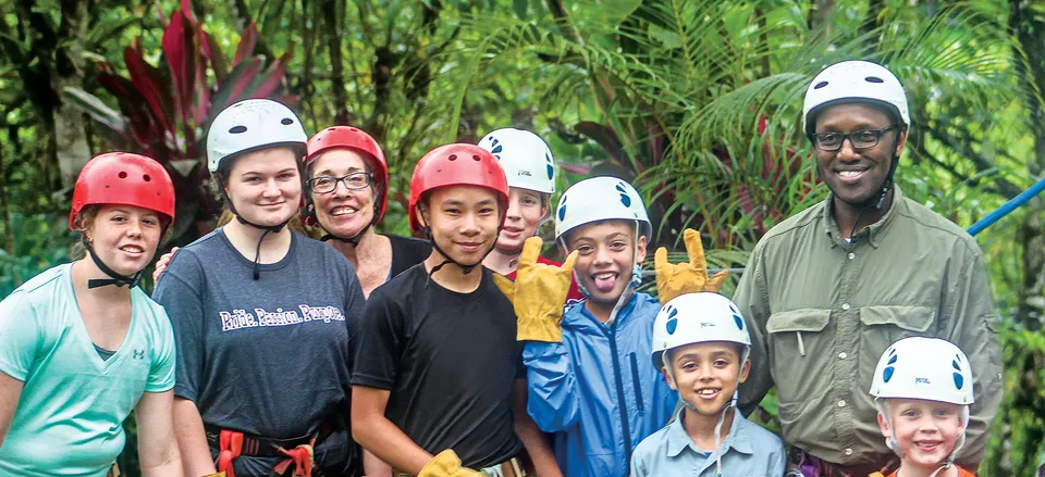  Kids and parents prepare for the rain forest zip line. Credit: Dennis Wille
