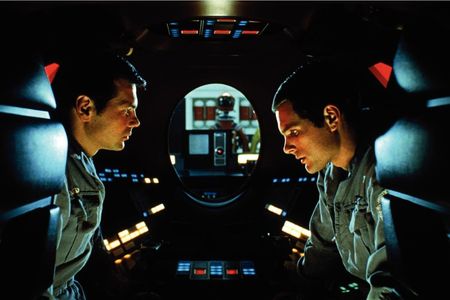 The astronauts of "2001: A Space Odyssey" hide in a pod to discuss the troubling behavior of their spacecraft's artificial intelligence, HAL 9000. In the background, HAL is able to read their lips.
