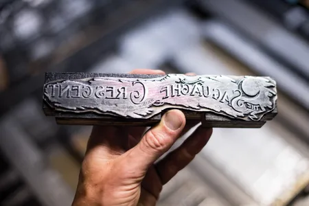 The Saguache Crescent&rsquo;s masthead is cast from lead in a process that allows it to survive a year of printing.