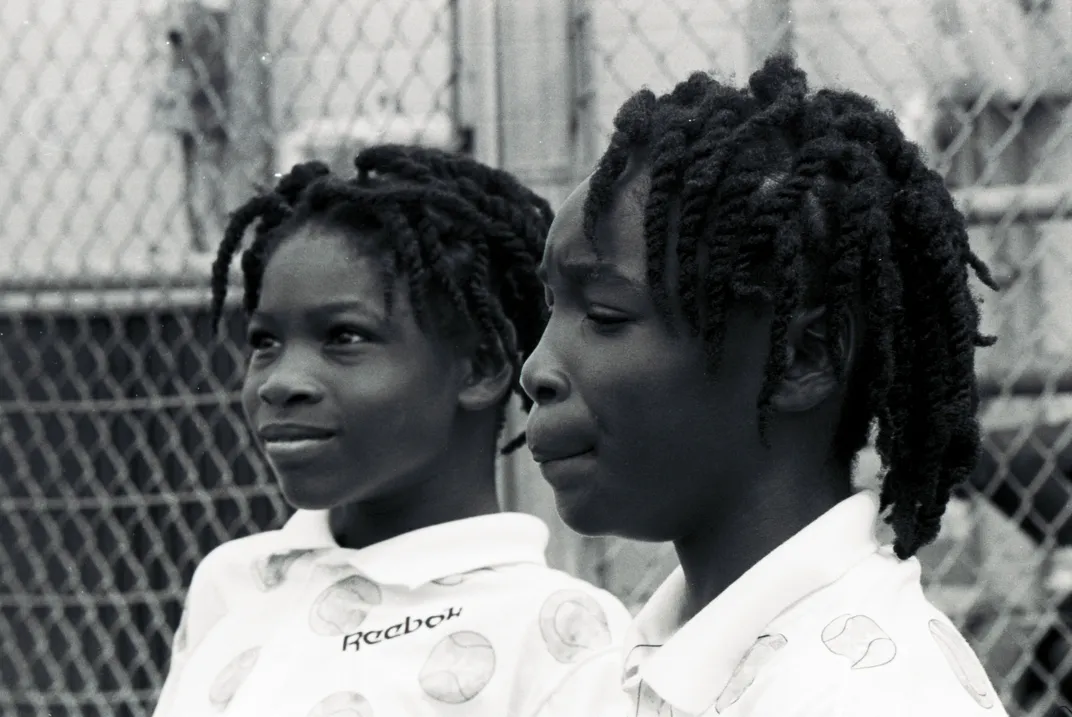 Venus (right) and Serena (left) Williams on the tennis court in 1991