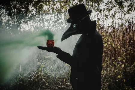 The green gas emanating from this small jack-o&rsquo;-lantern alludes to the spread of Covid-19. Fittingly, the photographer&rsquo;s subject dons a beaked mask based on the ones worn by physicians treating bubonic plague victims in 17th-century Europe.