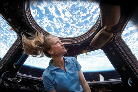Astronaut Karen Nyberg enjoys the magnificent view from the ISS Cupola in 2013.