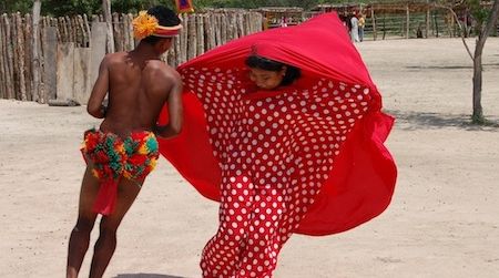 Two Wayuu dancers from La Guajira Province in northern Colombia perform a courtship dance.