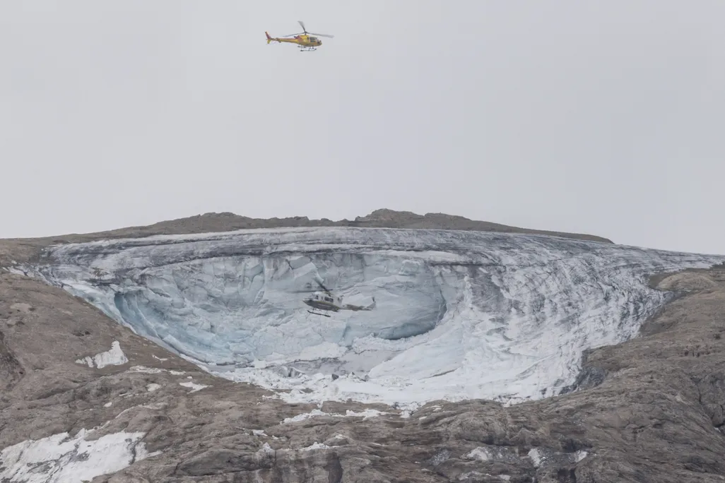 Helicopter above glacier