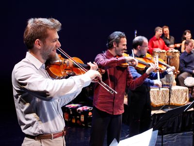 Johnny Gandelsman (violin), Colin Jacobsen (violin), and Nicholas Cords (viola) performing with fellow Silk Road Ensemble musicians