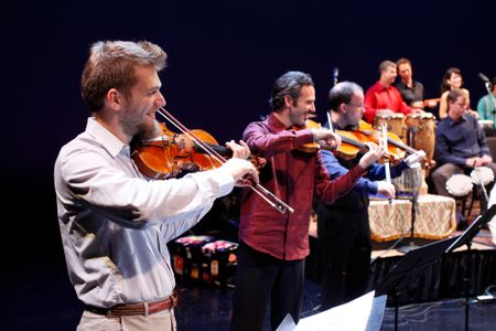 Johnny Gandelsman (violin), Colin Jacobsen (violin), and Nicholas Cords (viola) performing with fellow Silk Road Ensemble musicians