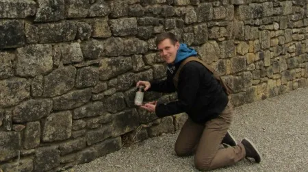 Ed Heseltine, a British traveler currently living in the Dordogne, shows the first of two beers that he found stashed months earlier by the author of “Off the Road.”