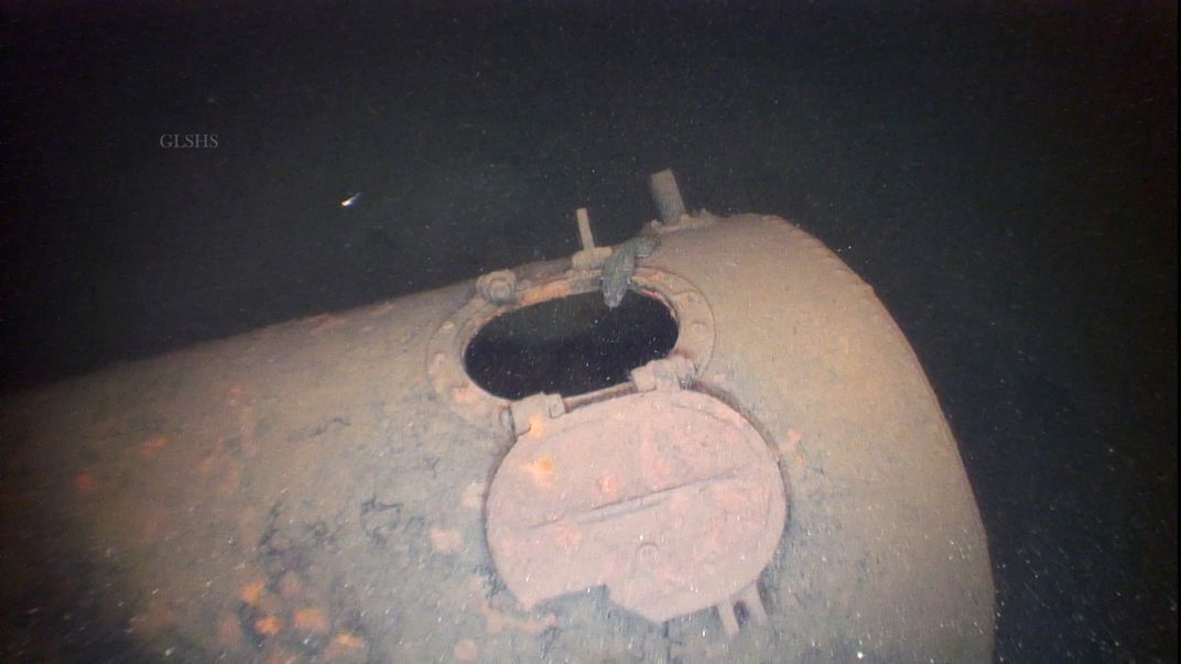 Underwater view of shipwreck smokestack
