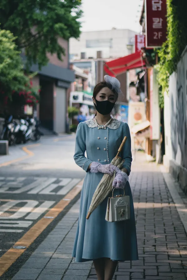 A Korean woman wearing a vintage dress in Seoul. thumbnail