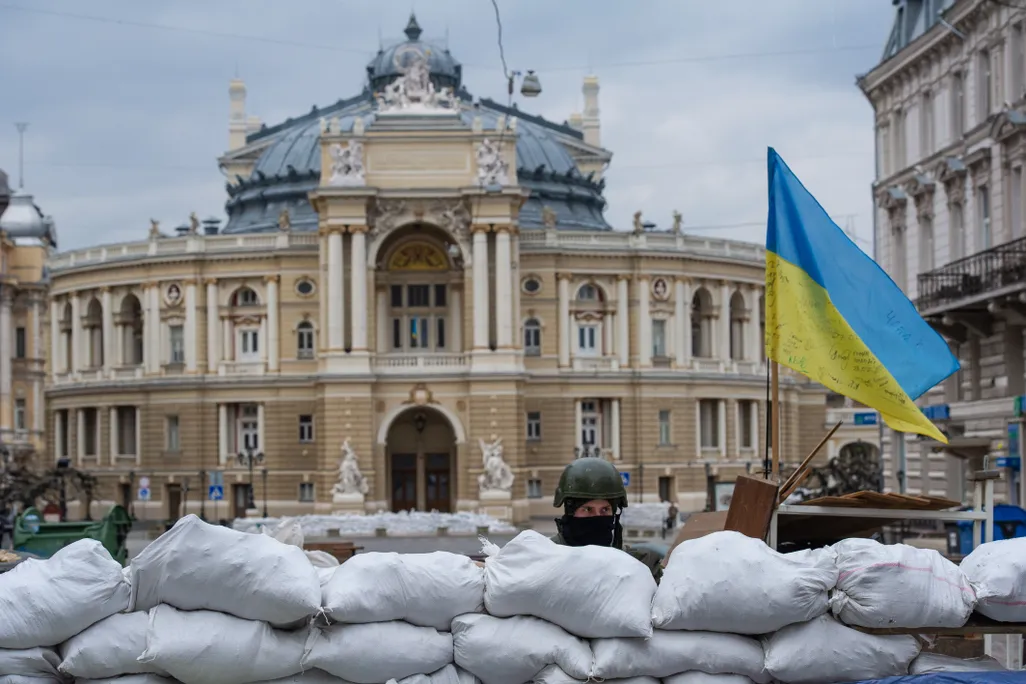 A soldier standing guard over the Odesa Opera and Ballet Theater in March 2022