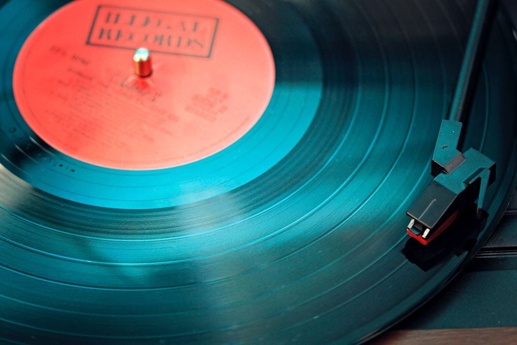 Close-up shot of vinyl record on record player