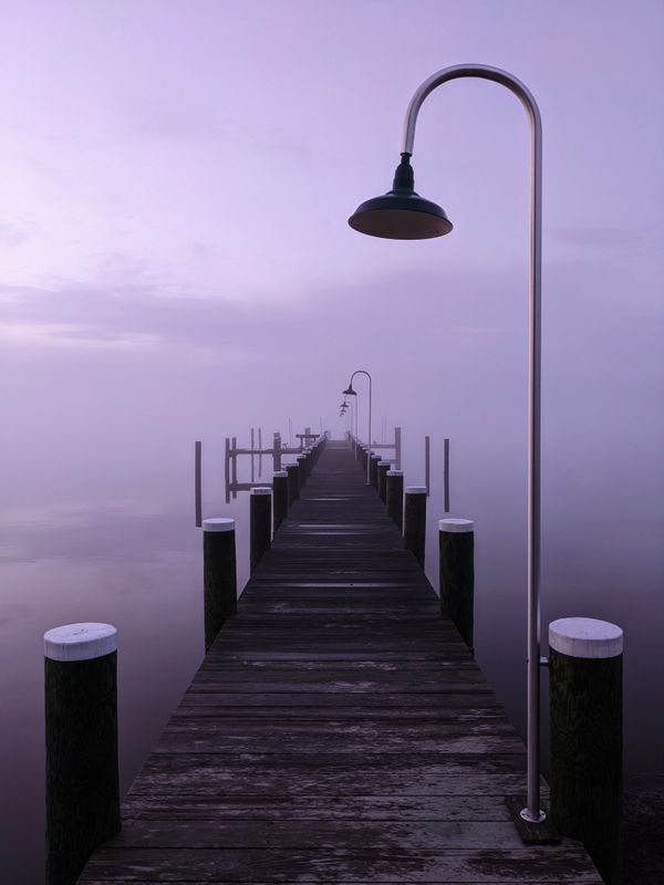 A pier in the morning fog on the Choptank River in Maryland. thumbnail