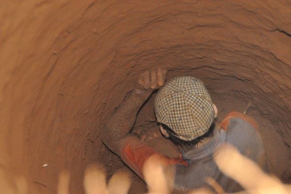 A man in a hole, searching for diamonds thumbnail