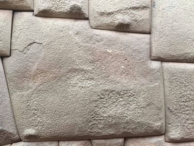 A man attacked the stone with a metal object.