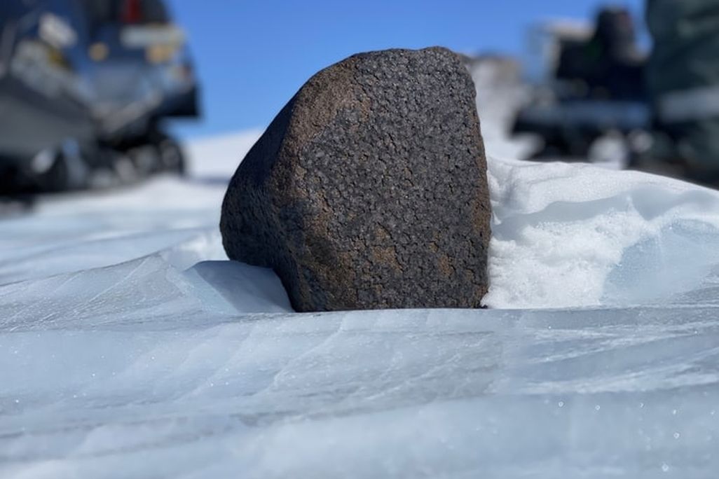 black meteorite in snow