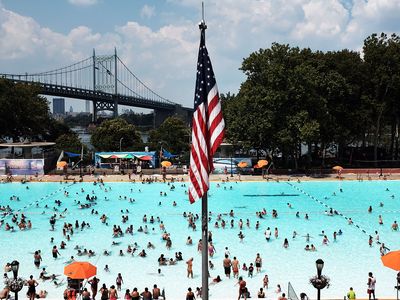People enjoy a hot afternoon at the Astoria Pool in the borough of Queens on August 17, 2015, in New York City.