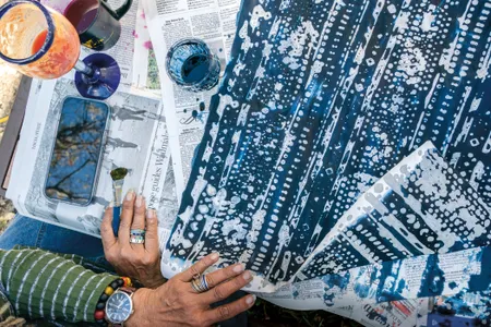 Artist Arianne King Comer works with indigo ink and rice paper at a farm on Wadmalaw Island, South Carolina.