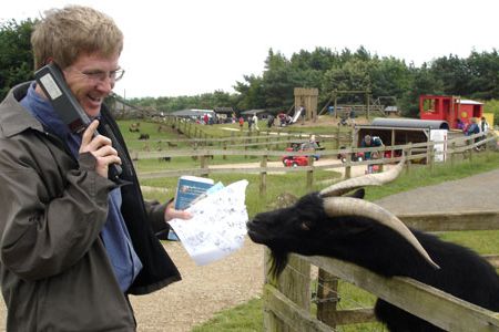 A hungry goat eats Rick Steves' map at the Cotswold Farm Park.