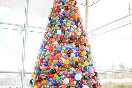 The 14-foot holiday tree at The Corning Museum of Glass contains 2,000 glass ornaments made by a team of glassmakers.