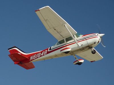 Cessna 172 single engine aircraft (N61848), flies overhead after becoming airborne.

