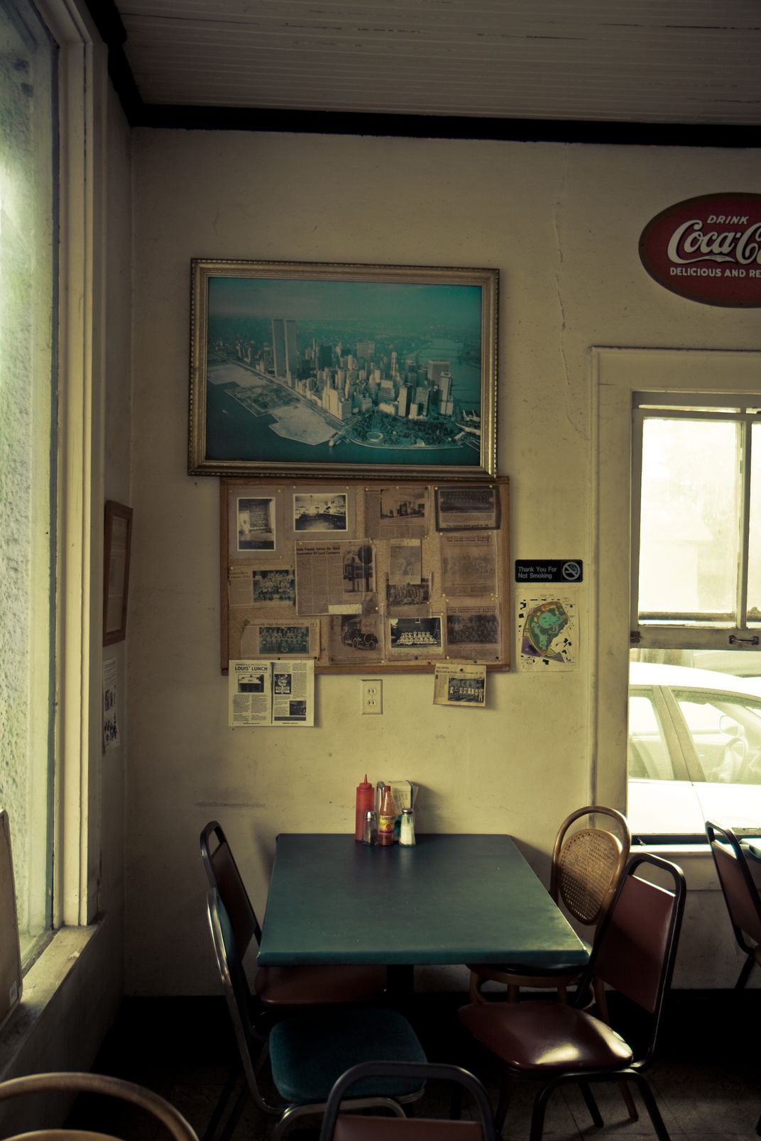 A photograph of NYC with the Twin Towers in Louis Lunch, Gainesville, FL. | Smithsonian Photo ...