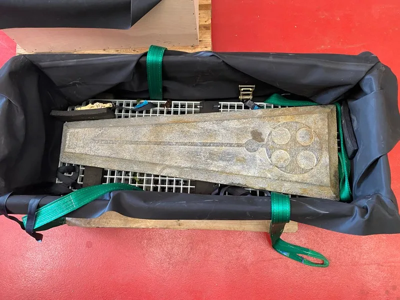 Grave slab in a crate as seen from above