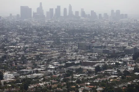 Smog hangs over downtown Los Angeles, here in 2019.&nbsp;A new study found links between&nbsp;heavy&nbsp;air pollution and historical redlining in urban areas.