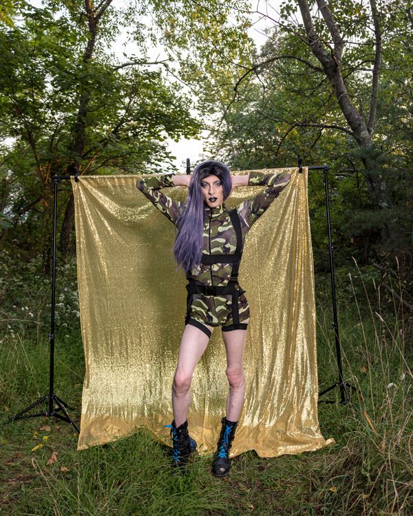 Drag queen Aradia poses in the forest near an abandoned plastics factory in Appalachia. thumbnail