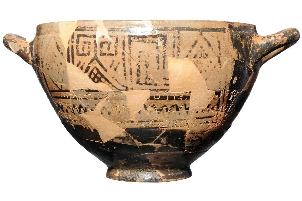 clay cup featuring black geometrical designs