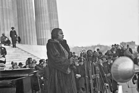 Beneath Anderson's coat is a bright orange velour jacket, a form-fitting number trimmed in gold with turquoise buttons, now among the collections at the Smithsonian.