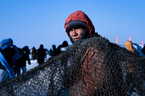 Fisherman carrying fishing nets thumbnail