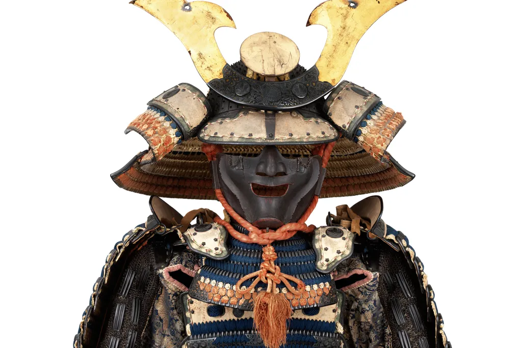 OPENER DETAIL - This suit of armor bears the crest of the powerful Ikeda family. The helmet dates to the 14th century, and the suit—including the bear-fur shoes—dates to the 18th.