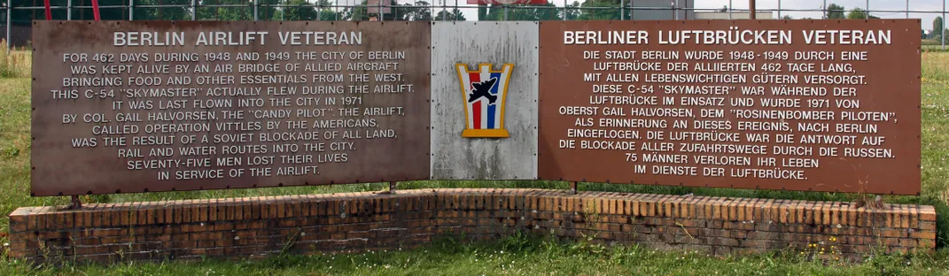 Two rectangular Stone Monuments side by side outlining story of Candy Bomber