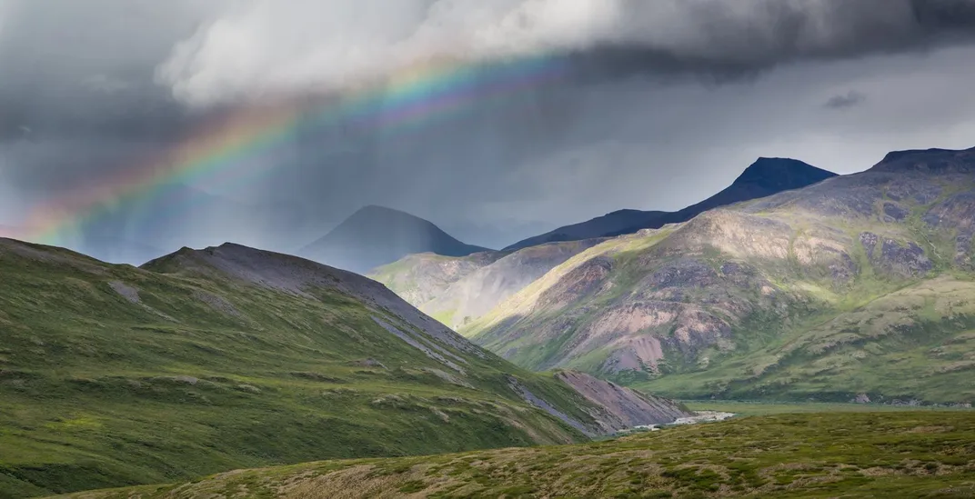 rainbow over beautiful mountainous landscape